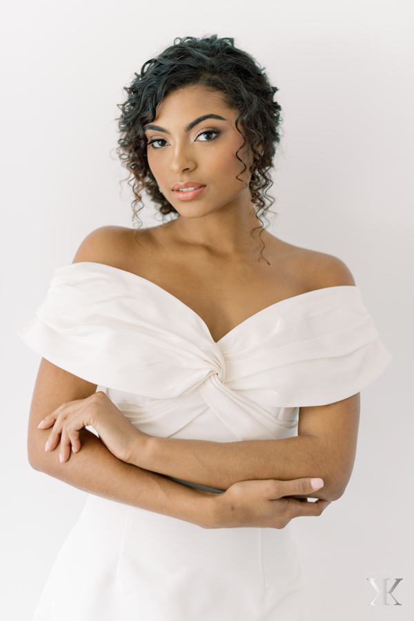 bride wears off the shoulder Carolina Herrera wedding dress