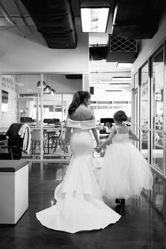 bride and flower girl at balcony wedding